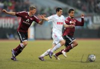 Fussball 1. Bundesliga, Saison 2011/2012: Mike Frantz  (li, 1 FC Nuernberg) gegen Mato Jajalo (Mitte, 1. FC Koeln) gegen Daniel Didavi  (1 FC Nuernberg)