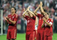 Fussball 1. Bundesliga, Saison 2011/2012:  JUBEL mit Daniel van Buyten, Bastian Schweinsteiger, Philipp Lahm  (v. li., FC Bayern Muenchen)
