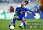 Fussball 1. Bundesliga: Bremen - Rostock, Zweikampf