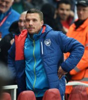 Fussball CHL  Saison 2014/2015: Lukas Podolski (Arsenal) auf der Ersatzbank
