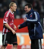 Fussball 1. Bundesliga :  Andreas Wolf  mit Trainer Dieter Hecking (v.li., 1 FC Nuernberg)