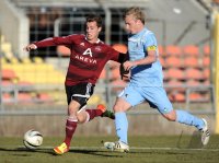 Fussball Regionalliga Sued 2011/2012:  Sinan Tekerci  (li. 1. FC Nuernberg) gegen Christoph Rech (re, TSV 1860 Muenchen)