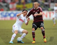 Fussball 1. Bundesliga, Saison 2011/2012: Slawomir Peszko (li, 1 FC Koeln) gegen Adam Hlousek (1 FC Nuernberg)