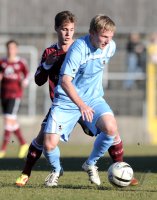 Fussball Regionalliga Sued 2011/2012:  Sinan Tekerci  (li. 1. FC Nuernberg) gegen Christoph Rech (re, TSV 1860 Muenchen)
