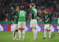 Fussball DFB Pokal 10/11 : (v. li) Enttaeuschung bei Bremen von Clemens Fritz, Sebastian Proedl, Per Mertesacker, Philipp Bargfrede