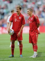 Fussball 1. Bundesliga 2011/2012:  Bastian Schweinsteiger (FC Bayern Muenchen) und Holger Badstuber (FC Bayern Muenchen)