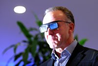 Fussball 1. Bundesliga, Saison 2011/2012:  Vorstandsvorsitzender Karl Heinz Rummenigge (FC Bayern Muenchen) schaut mit einer 3 D Brille fern