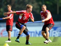 Fussball 1. Bundesliga Saison   2011/2012 : Holger Badstuber , Bastian Schweinsteiger (v. li., FC Bayern Muenchen)