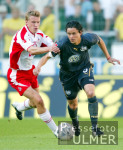 Fussball 1. Bundesliga: Koeln - Wolfsburg, Zweikampf