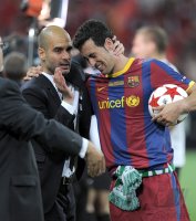 Fussball Champions League Finale 2011: Trainer Josep Guardiola mit Sergio Busquets (v. li., Barca)