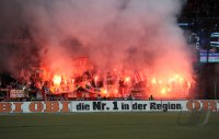 Fussball 1. Bundesliga, Saison 2011/2012:  Koeln Fankurve mit einem Bengalischen Feuer zum Fasching