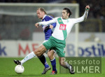 Fussball 1. Bundesliga: Bremen - Rostock, Zweikampf