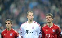 Fussball CHL  Saison 2011/2012:  Philipp Lahm, Torwart Manuel Neuer , Thomas Mueller (v. li., FC Bayern Muenchen)