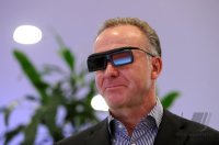 Fussball 1. Bundesliga, Saison 2011/2012:  Vorstandsvorsitzender Karl Heinz Rummenigge (FC Bayern Muenchen) schaut mit einer 3 D Brille fern