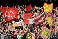 Fussball 1. Bundesliga, Saison 2011/2012:  Nuernberg  Fankurve mit Fahnen