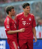 Fussball 1. Bundesliga, Saison 2011/2012:  JUBEL nach dem Tor Thomas Mueller, Mario Gomez (v. li., FC Bayern Muenchen)