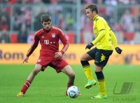 Fussball 1. Bundesliga, Saison 2011/2012: Thomas Mueller (li, FC Bayern Muenchen) gegen Mario Goetze (Borussia Dortmund)
