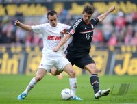 Fussball 1. Bundesliga, Saison 2011/2012:  Lukas Podolski (li, 1. FC Koeln) gegen Mario Gomez (FC Bayern Muenchen)