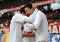 Fussball 1. Bundesliga, Saison 2011/2012:  Jubel nach dem Tor zum 1:1 Milivoje Novakovic (re.) mit Odise Roshi (1. FC Koeln)