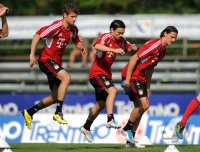Fussball 1. Bundesliga Saison   2011/2012 : Thomas Mueller , Danijel Pranjic , Daniel van Buyten (v. li., FC Bayern Muenchen)