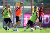 Fussball 1. Bundesliga:  Bastian Schweinsteiger gegen Diego Contento (v.li., FC Bayern Muenchen)