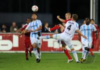 1. Fussball Bundesliga: Mate Ghvinianidze  (li, 1860 Muenchen) gegen Mladen Petric  (mitte, HSV) gegen Kai Buelow (re, 1860 Muenchen)