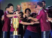 Fussball: DFB Pokal Finale:  Kyriakos Papadopoulos, Torwart Mathias Schober, Hao Junmin, Klaas Jan Huntelaar (v. li., FC Schalke 04)