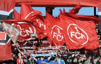 Fussball 1. Bundesliga, Saison 2011/2012:  Nuernberg  Fankurve mit Fahnen
