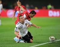 Fussball International EM 2012-Qualifikation:  Lukas PODOLSKI (li, Deutschland) gegen Goekhan Goenuel (re, Tuerkei)
