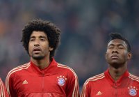 FUSSBALL INTERNATIONAL CHL VIERTELFINALE 12/13: Dante (FC Bayern Muenchen) und Alaba (FC Bayern Muenchen)