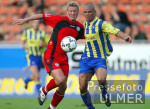 Fussball - DFB-Pokal: Braunschweig - Reutlingen, Zweikampf