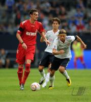FUSSBALL: LIGA TOTAL CUP 2010 , Milivoje Novakovic (li, Koeln) gegen Anatoliy Tymoshchuk , Anatoli Timoschtschuk (re, FCB)