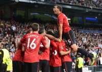 FUSSBALL INTERNATIONAL CHL ACHTELFINALE 12/13:  Jubel mit Michael Carrick, Robin van Persie und oben auf Rio Ferdinand (v. li., Manchester United FC)