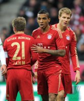 Fussball 1. Bundesliga, Saison 2011/2012:Philipp Lahm, Luiz Gustavo, Holger Badstuber (v. li., FC Bayern Muenchen)