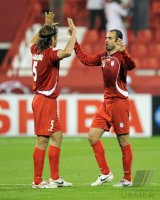 Fussball AFC Asian Cup 2011: Jubel Hadi Aghily, Mohammad Nosrati (v. li., Iran)