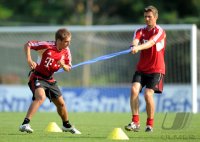 Fussball 1. Bundesliga Saison   2011/2012 : Philipp Lahm , Torwart Hans Joerg Butt (v. li., FC Bayern Muenchen)