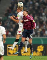 Fussball DFB Pokal 11/12 :  Mike Hanke (li, Borussia Moenchengladbach)  gegen Marco Hoeger (FC Schalke 04)