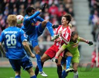 Fussball 1. Bundesliga : (v. li.) Marvin Compper (li, TSG 1899 Hoffenheim) gegen Mario Gomez (FC Bayern Muenchen) gegen Tom Starke (re, TSG 1899 Hoffenheim)