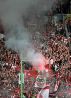 Fussball 1. Bundesliga, Saison 2011/2012:   FC Bayern Muenchen Fans mit einem Bengalischen Feuer