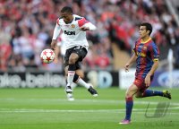 Fussball Champions League Finale 2011: Patrice Evra (li, Manchester United FC) gegen Pedro Rodriguez  (re, Barca)